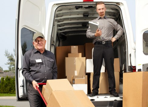 Man and van loading furniture in a Petersham residential street