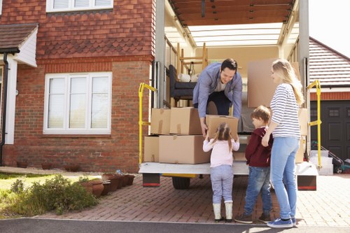 Removal team planning a move in Petersham with boxes and furniture