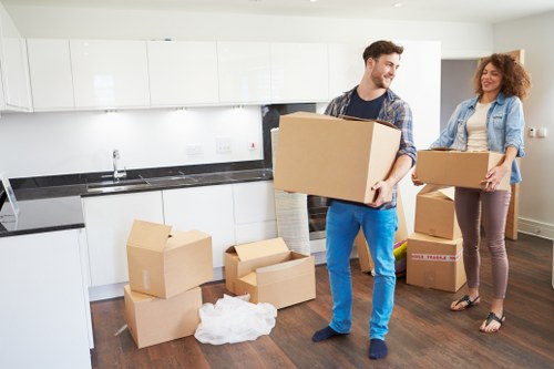 Moving team preparing household items for transport in Petersham